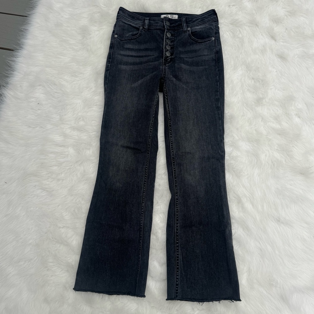 Dark wash jeans by We The Free.  Size 27.